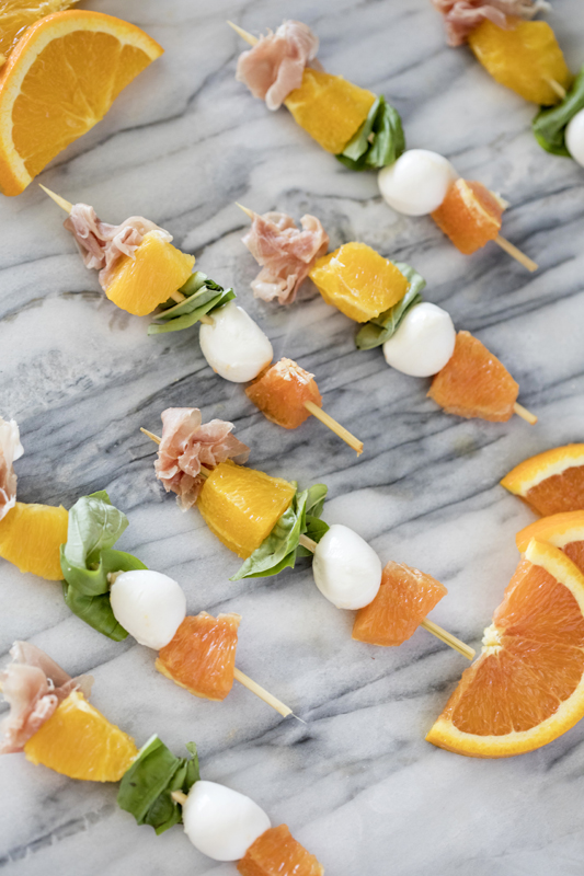 orange caprese skewer appetizer Little Cutie baby shower food ideas. Check out this list of Little Cutie baby shower ideas. Includes ideas for favors, food, decorations and more.