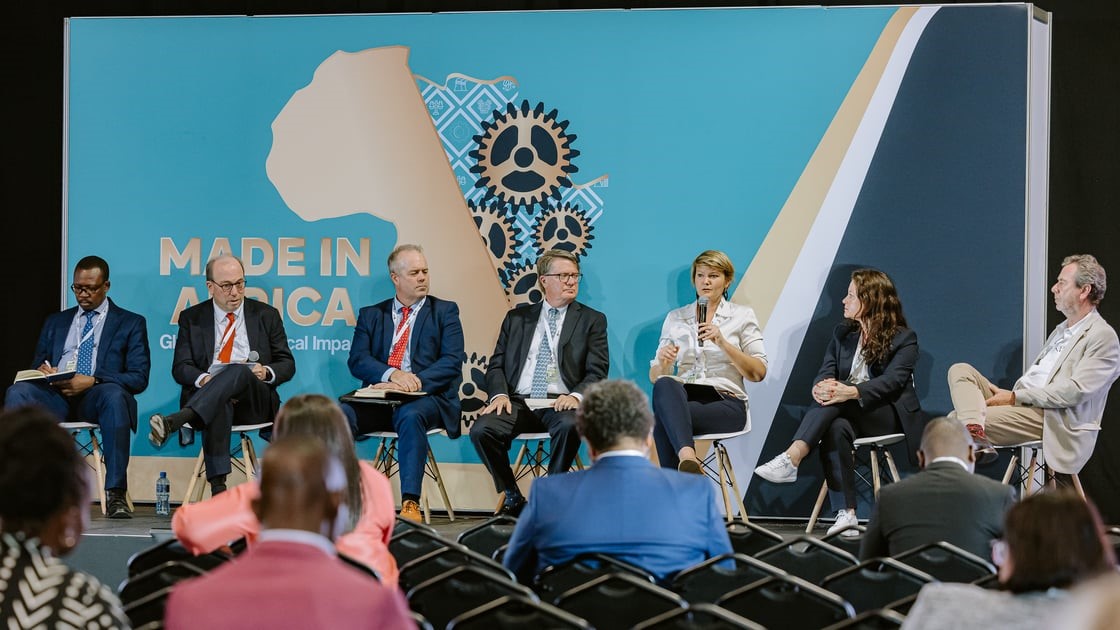 Group of People on Stage at Trade Show